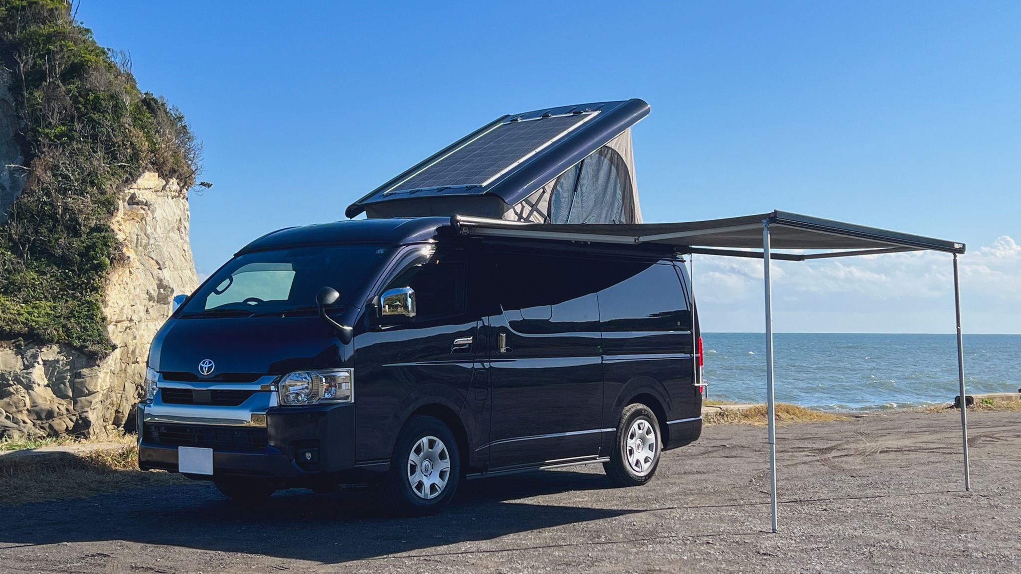 Perfect spot for your coastal getaway! Our Toyota Hiace camper van comes fully equipped with:
- Pop-up roof for extra headroom
- Side awning for outdoor living
- Solar panel for sustainable power
- Sleek black exterior that turns heads

Imagine waking up to views like this - the ocean breeze, rocky cliffs, and endless possibilities for adventure.

Ready to start your journey? Book your 3rd Place Camper experience today 🌊

#3rdPlaceCamper #VanLife #CamperVan #JapanTravel #RoadTrip #OutdoorLife #キャンピングカー #キャンプ旅 #車中泊 #アウトドア #ハイエース